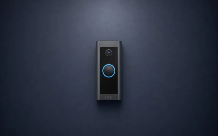 A Ring video doorbell, its camera and lit ring facing out.