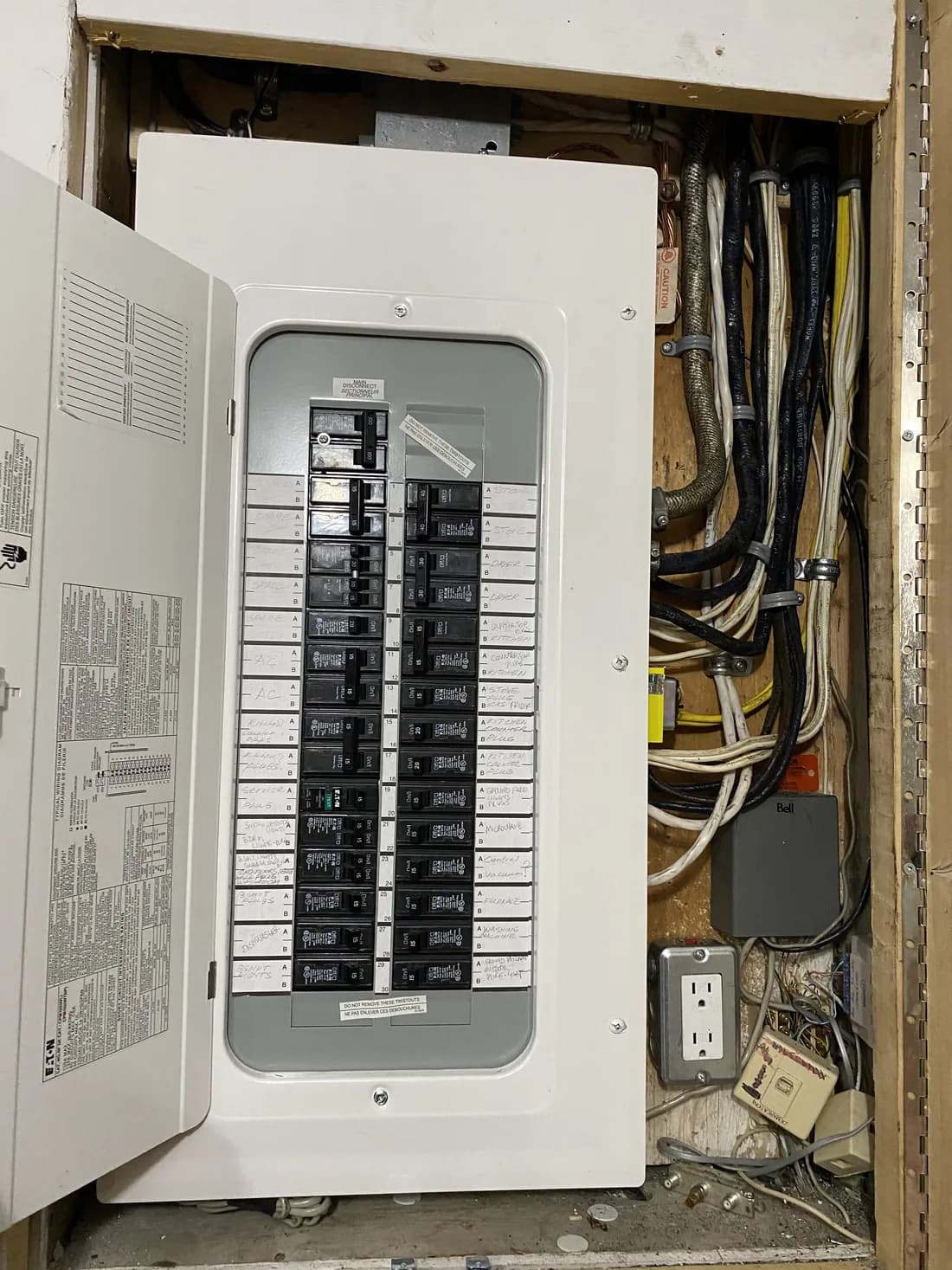 The same recess after the upgrade: a modern breaker panel, every circuit landed and hand-labelled.