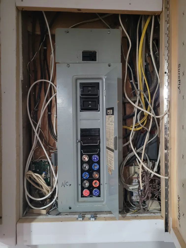 The original fuse panel: screw-in fuses, cloth-wrapped conductors and no room to add a circuit.